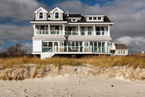 Back of custom home set on the beach