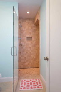 Tan tiled walk in shower