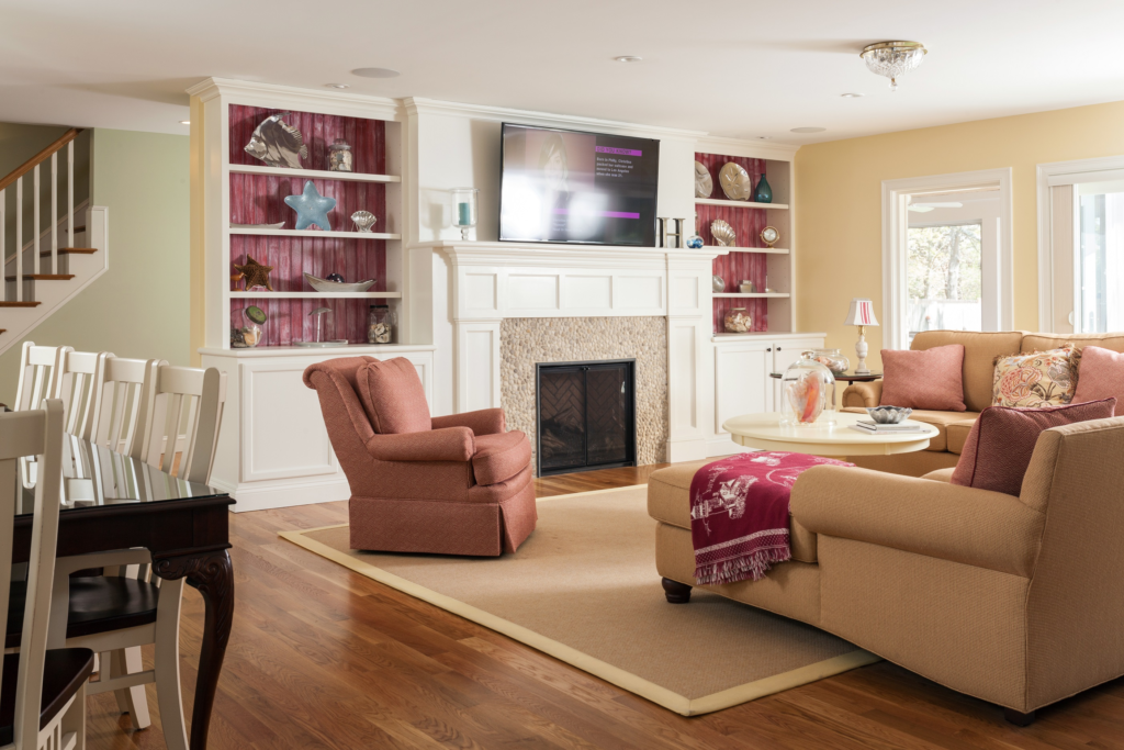 Living room with built ins and a fireplace
