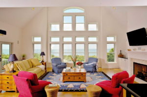 Large living room with windows in the shape of a pyramid